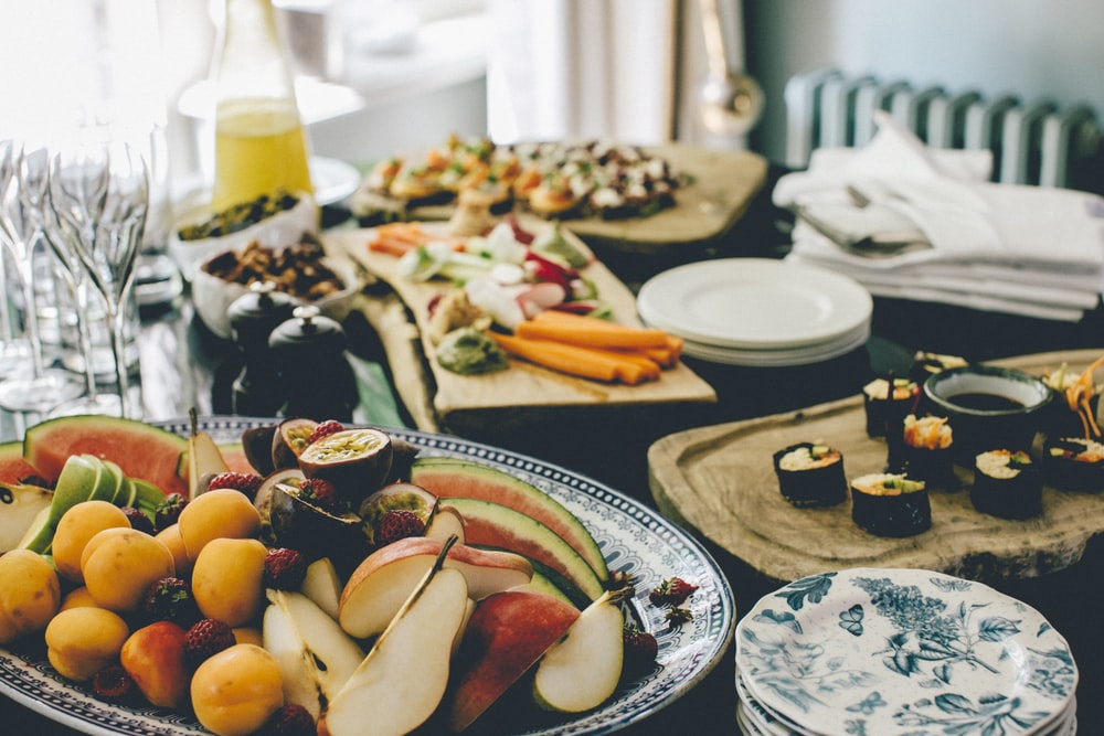a wide variety of fruits and foods in a hotel room